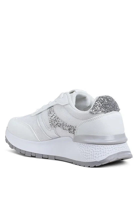White sneaker with silver glitter detail on heel and side, chunky sole, isolated on white