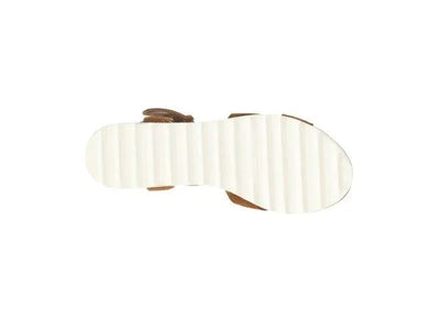 White ridged rubber sandal sole with brown leather straps, isolated on white background