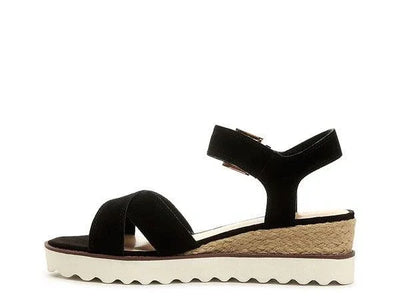 Black suede women's espadrille sandal with platform sole and ankle strap on white background