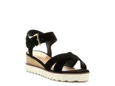 Black suede platform wedge sandal with cork sole and ankle strap, white ridged outsole