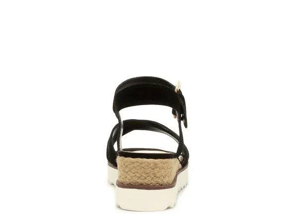 Back view of black platform sandal with woven jute heel and white rubber sole on white background