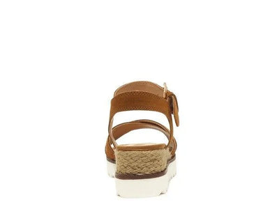 Brown strappy sandal with a woven espadrille platform and white sole, rear view