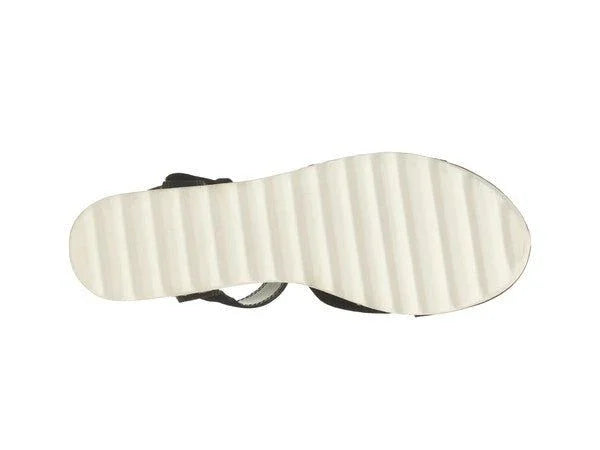 White ribbed sandal sole with black upper on white background, footwear product photo