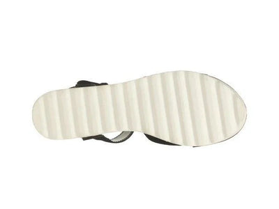 White ribbed sandal sole with black upper on white background, footwear product photo