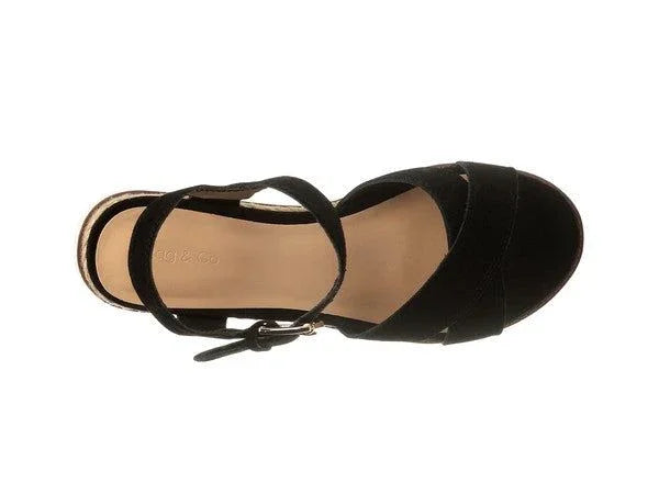 Black suede women's sandal with ankle strap and open toe, viewed from above on white background