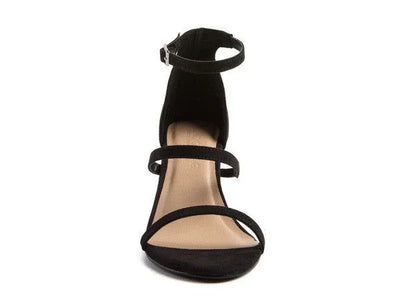 Black strappy high heel sandal with ankle strap on white background