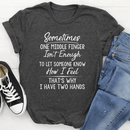Dark gray graphic tee with humorous white text, paired with ripped jeans and Converse shoes