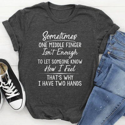 Dark gray graphic tee with humorous white text, paired with ripped jeans and Converse shoes