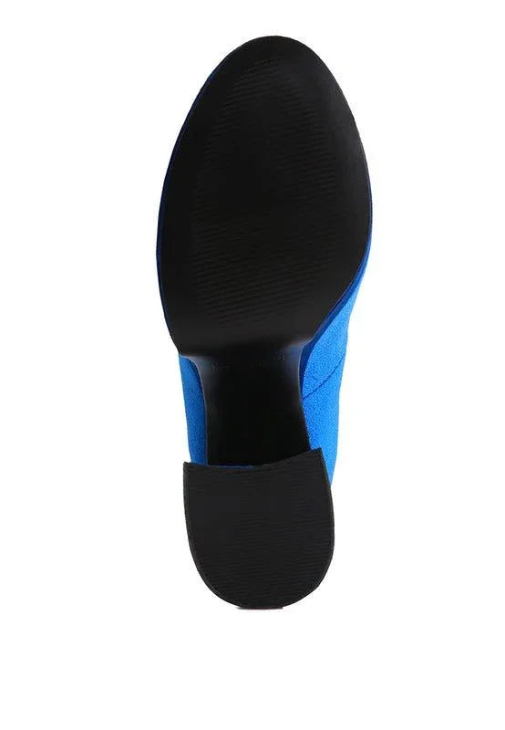 Black sole of a blue dress shoe on white background