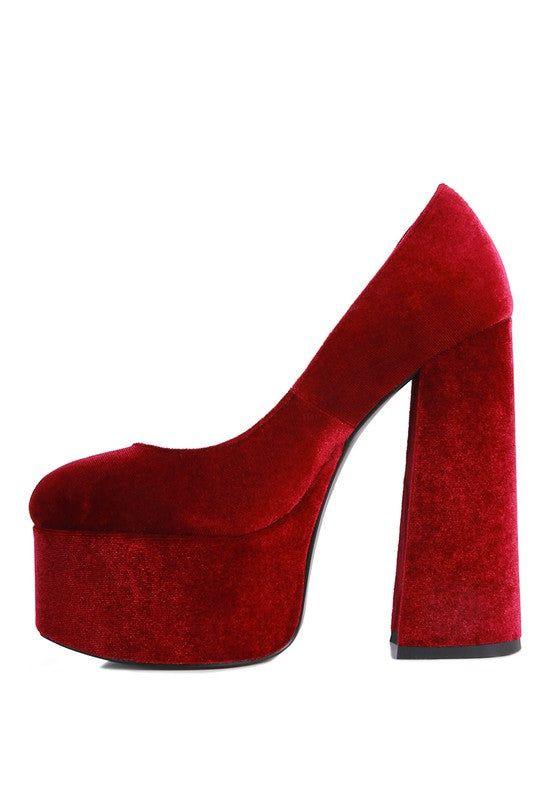 Red velvet platform high heel shoe with chunky block heel on white background