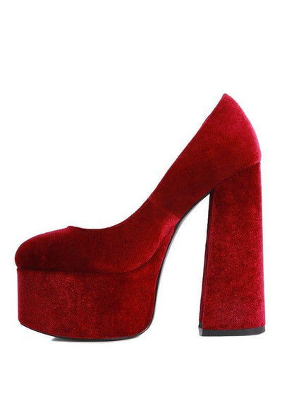 Red velvet platform high heel shoe with chunky block heel on white background