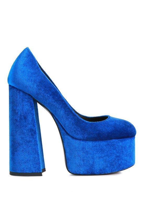 Bright blue velvet platform high heel shoe with chunky block heel on white background