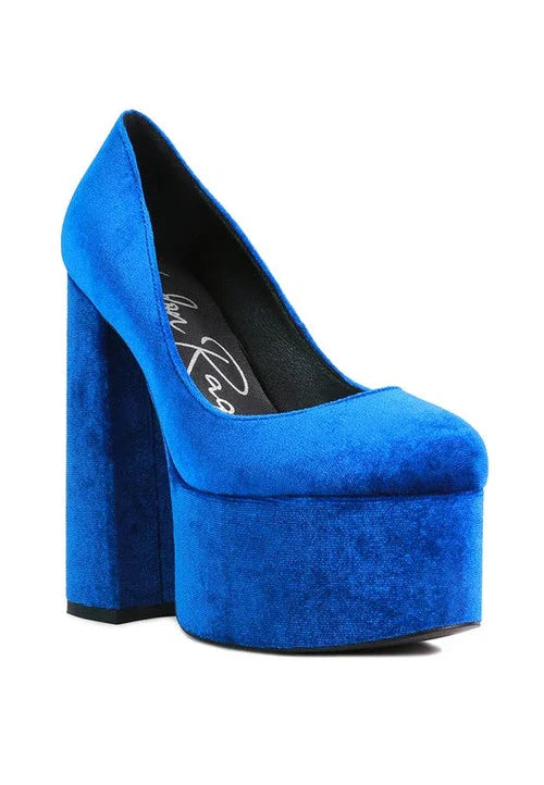 Bright blue velvet platform high heel shoe with chunky block heel on white background