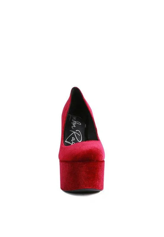 Front view of red velvet platform high heel shoe on white background