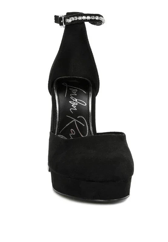 Black suede high heel platform pump with rhinestone ankle strap on white background