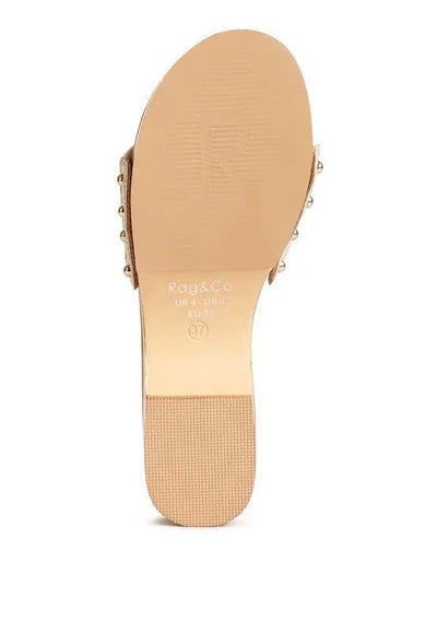 Beige Rag & Co sandal sole with size marking and textured heel, studded sides visible