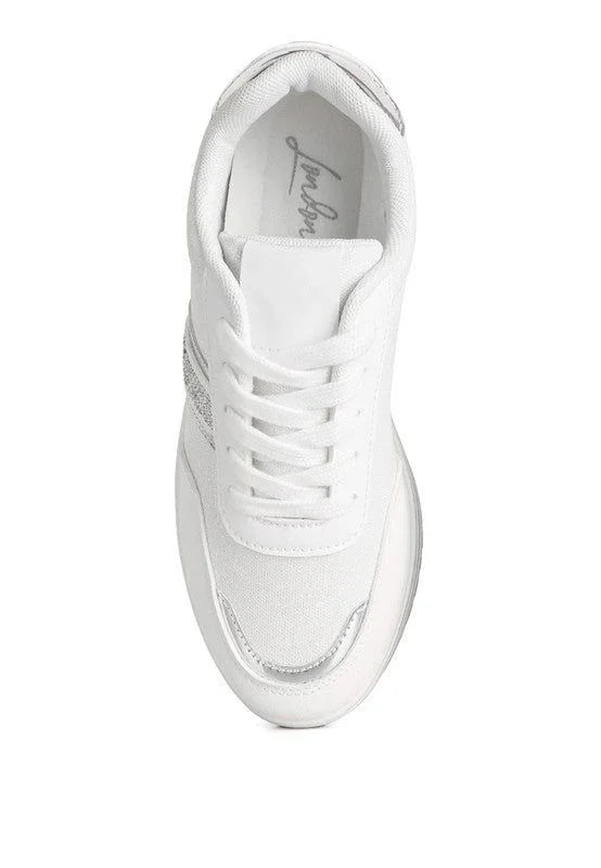 White lace-up sneaker with silver glitter detail, top view, fashion shoe on white background