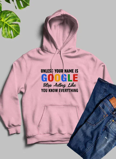 Pink hoodie with 'Unless your name is Google stop acting like you know everything' text, flat lay with jeans and green leaves