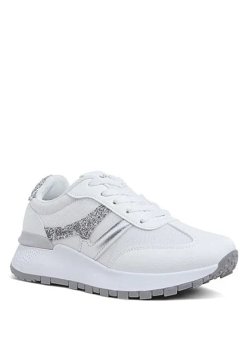 White sneaker with silver glitter accents and chunky sole, stylish athletic shoe