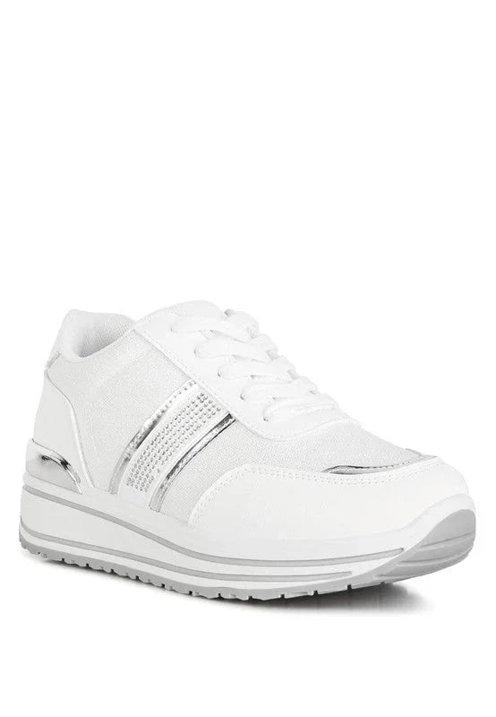 White women's sneaker with silver accents and textured sole, breathable athletic shoe