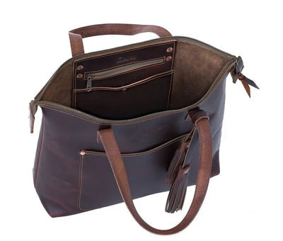 Brown leather tote bag with zipper, interior pockets, and tassel detail on handle