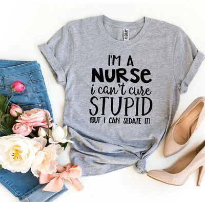 Gray nurse quote t-shirt styled with jeans, flowers, and nude heels on white background
