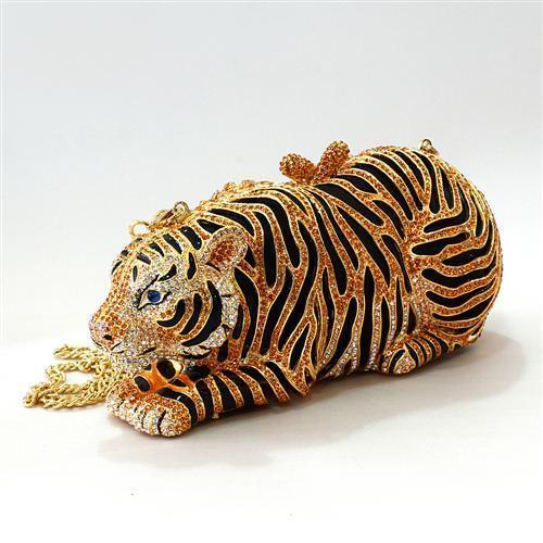 Jeweled tiger-shaped handbag with gold, black, and crystal accents on white background