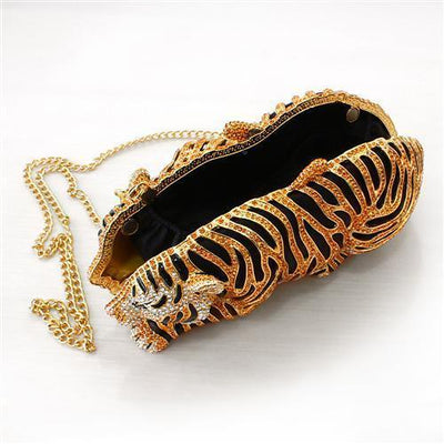 Gold crystal tiger clutch purse with black accents and chain strap, luxury evening bag