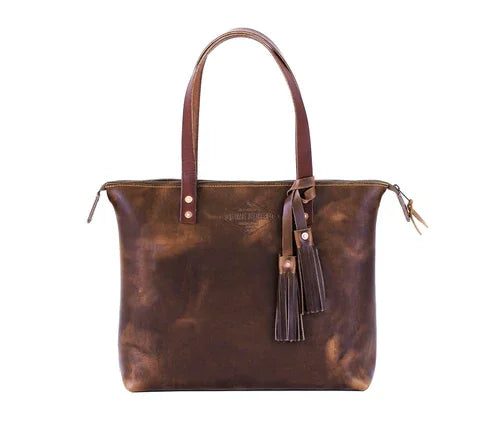 Brown leather tote bag with long handles and decorative tassels, minimalist design
