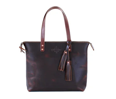 Dark brown leather tote bag with double handles and decorative tassels